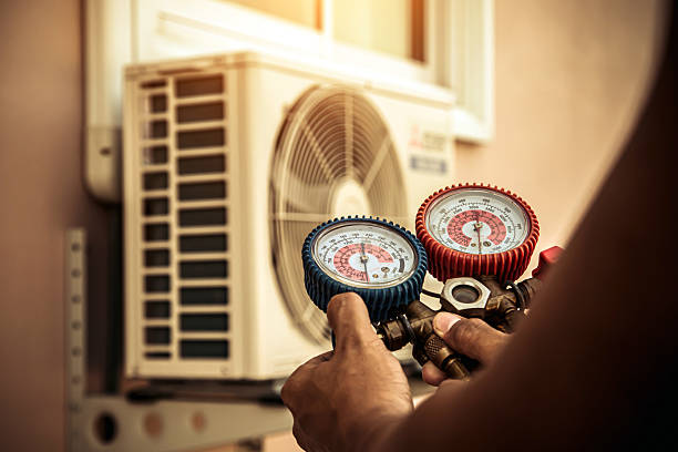 Professional Air Conditioning Service technician working in Saint James City, FL